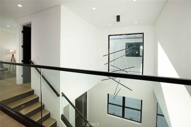 stairway featuring recessed lighting