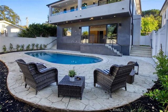 view of swimming pool featuring a fenced in pool, a patio, and a fenced backyard