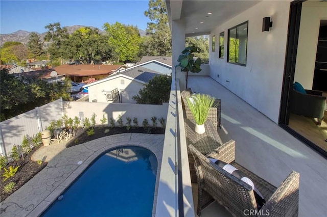 view of pool with a fenced in pool, a fenced backyard, and a patio area