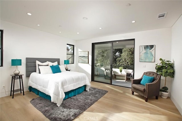 bedroom featuring access to outside, recessed lighting, and light wood-style floors