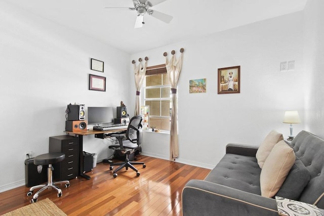 office with ceiling fan, baseboards, and wood finished floors