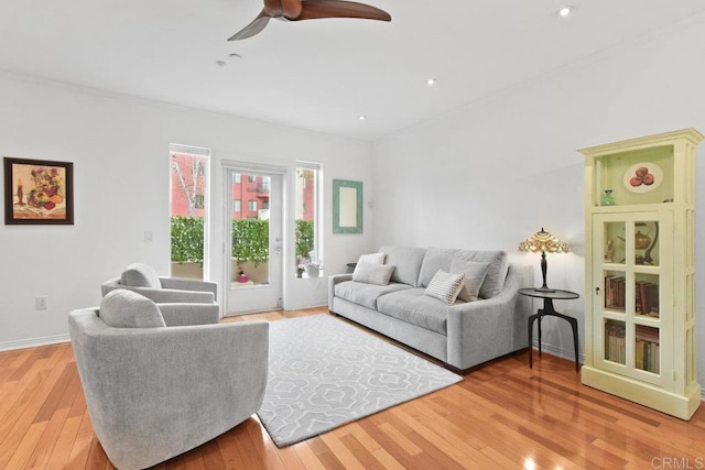 living room featuring light wood-style flooring, recessed lighting, baseboards, and ceiling fan