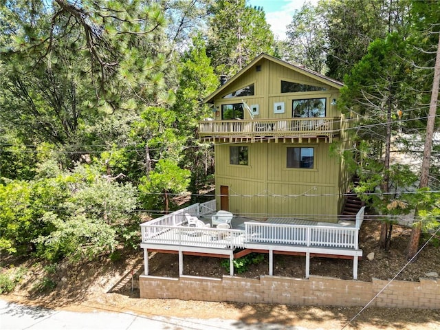 534 Dover Ct, Lake Arrowhead, CA 92352 - rear view of house featuring a balcony, a wooden deck, and stairs