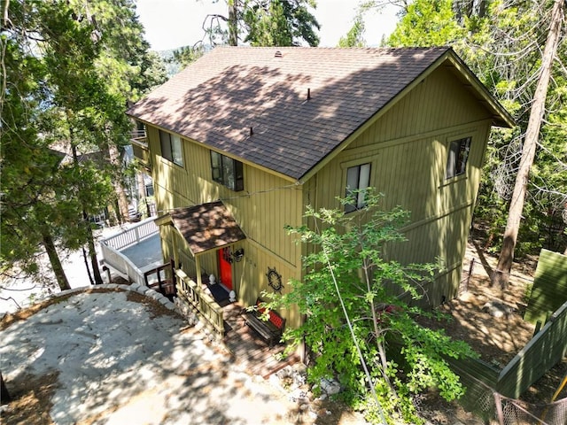 534 Dover Ct, Lake Arrowhead, CA 92352 - view of front of home with a shingled roof, an attached garage, and a wooden deck