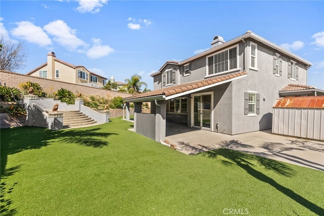 6136 Walnut Grove Ct, Rancho Cucamonga, CA 91739 - back of property featuring a patio area, stucco siding, a chimney, a yard, and a tiled roof
