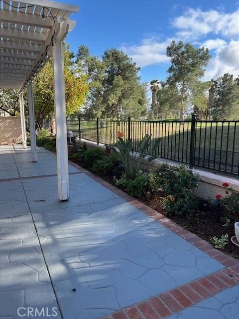 view of patio / terrace featuring a fenced backyard and a pergola