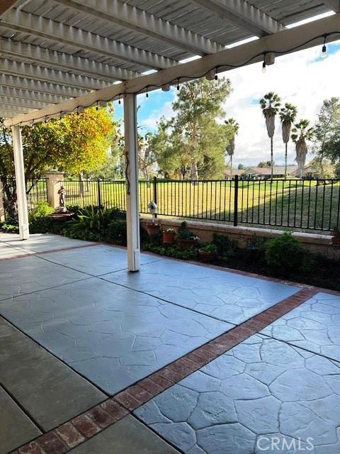 view of patio / terrace featuring fence and a pergola