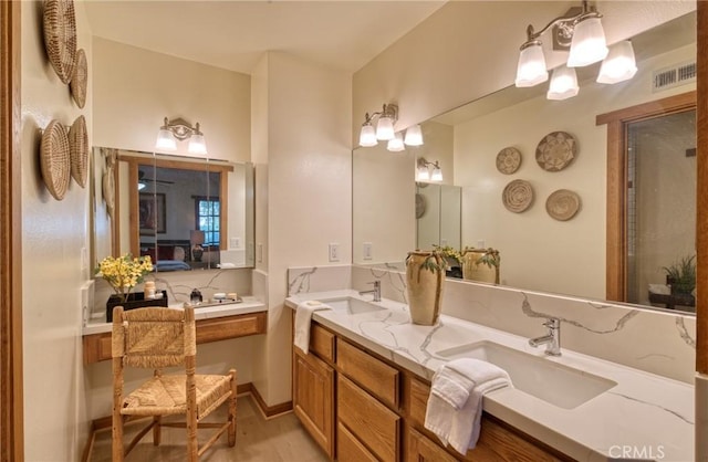 full bath featuring double vanity, visible vents, ensuite bathroom, and a sink