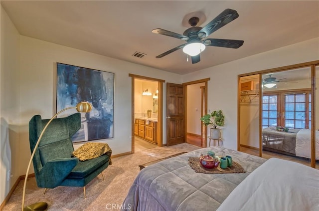 bedroom featuring visible vents, baseboards, french doors, a closet, and light colored carpet