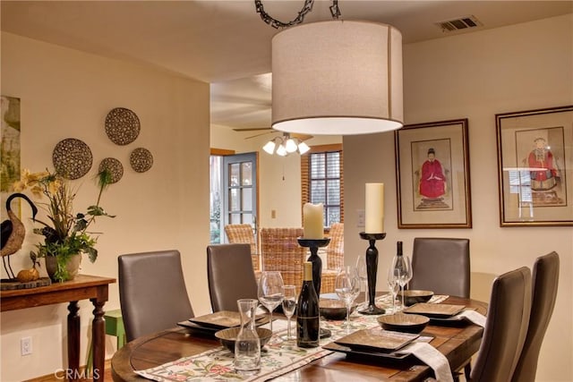 dining area with visible vents and ceiling fan