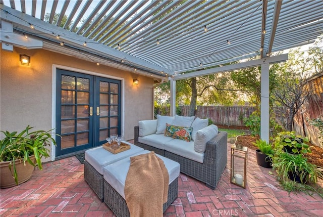 view of patio with an outdoor living space, french doors, fence, and a pergola