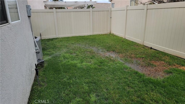 view of yard featuring a fenced backyard