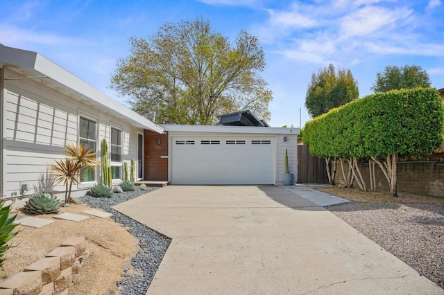 exterior space with fence and driveway