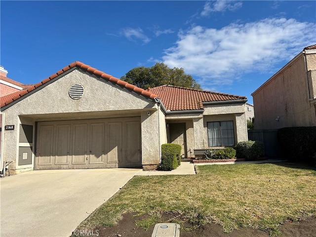 view of front of home featuring driveway, stucco siding, a front lawn, a garage, and a tile roof