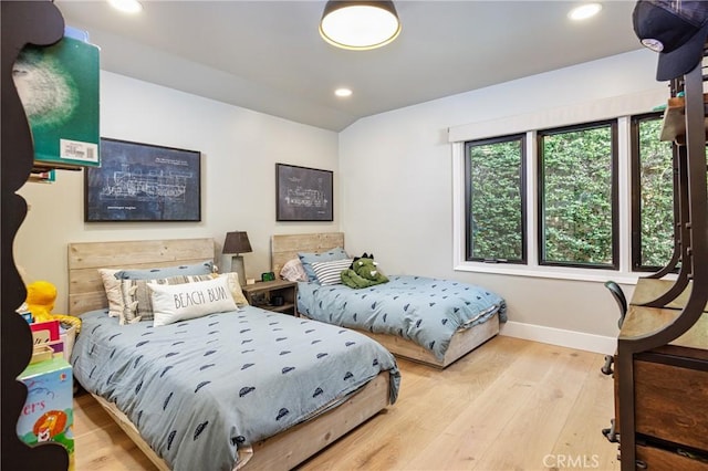 bedroom featuring recessed lighting, baseboards, and wood finished floors