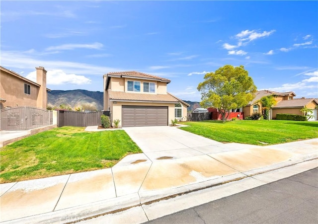 traditional-style home with stucco siding, a front lawn, fence, concrete driveway, and a tiled roof