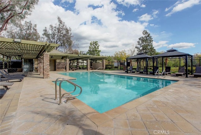 pool featuring a gazebo, fence, a patio area, and a pergola