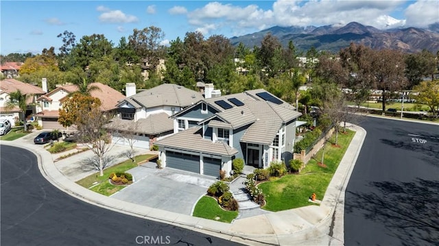 birds eye view of property with a residential view and a mountain view