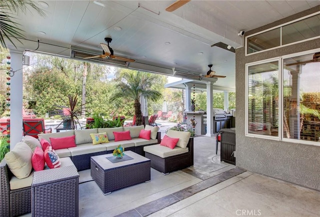 view of patio with an outdoor hangout area and ceiling fan