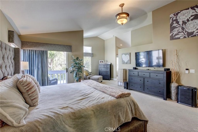 bedroom featuring light carpet, access to exterior, and vaulted ceiling