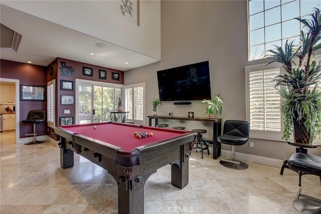 playroom with pool table, a high ceiling, and baseboards