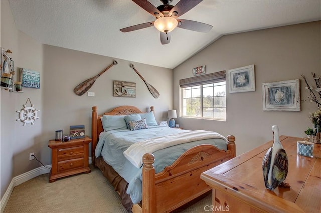 bedroom with baseboards, lofted ceiling, light colored carpet, and a ceiling fan