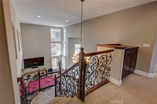 stairway featuring recessed lighting, baseboards, carpet floors, and an inviting chandelier