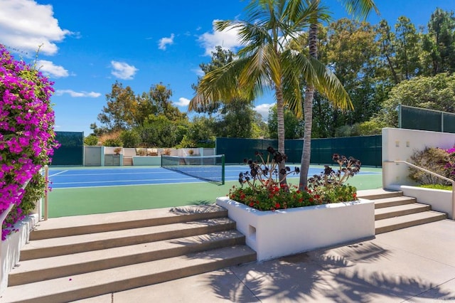 view of sport court featuring fence