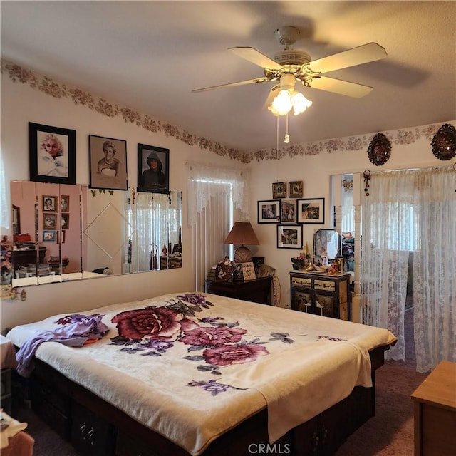 bedroom with carpet and a ceiling fan