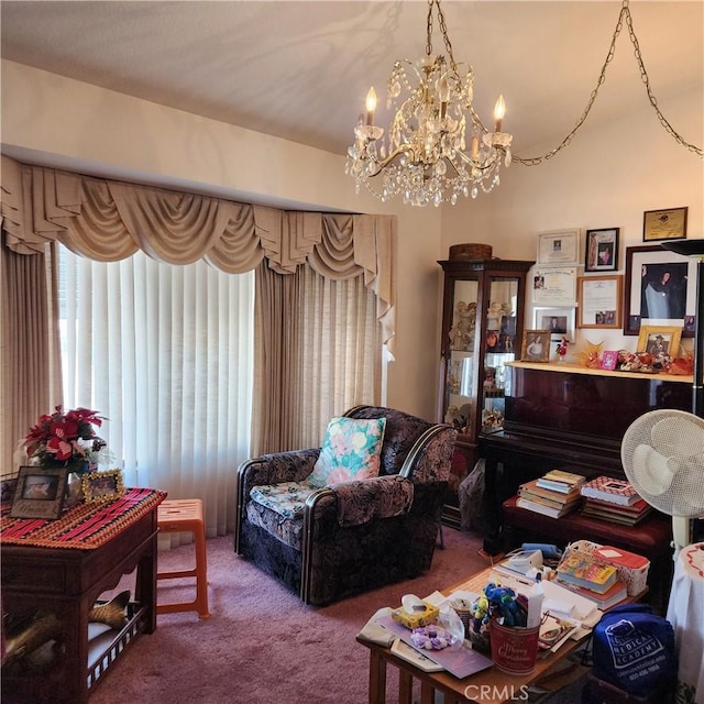 living room with a notable chandelier and carpet floors