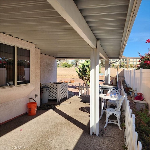 view of patio / terrace featuring fence