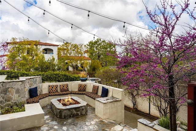 view of patio with a fire pit