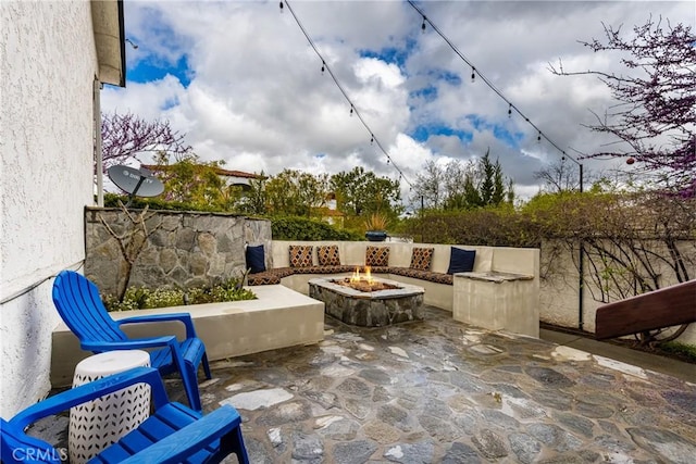 view of patio / terrace with a fire pit