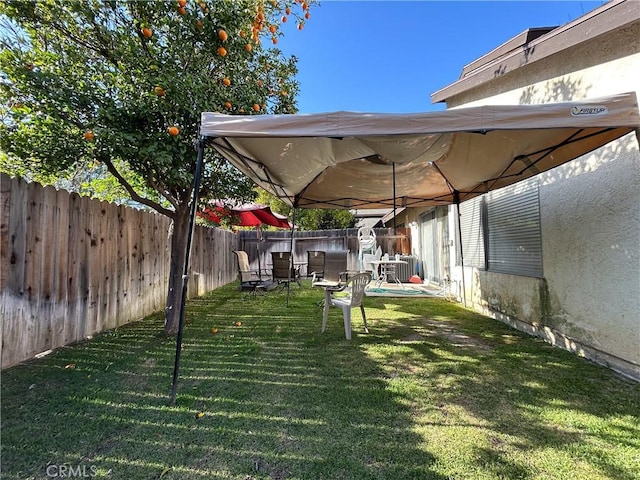 view of yard with a gazebo and a fenced backyard