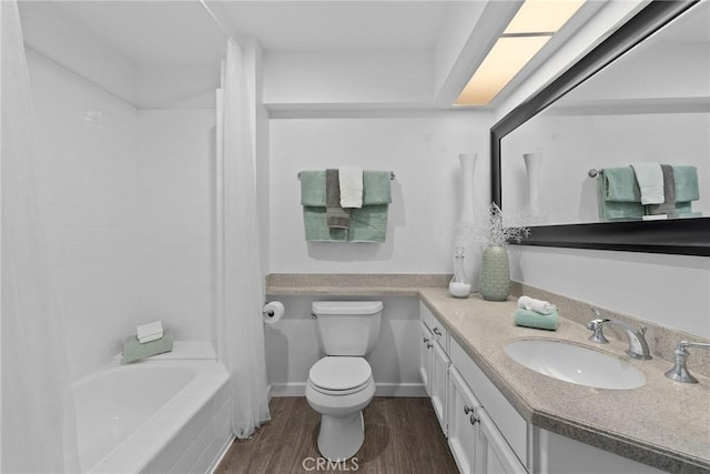 bathroom featuring vanity, shower / bath combination with curtain, toilet, and wood finished floors