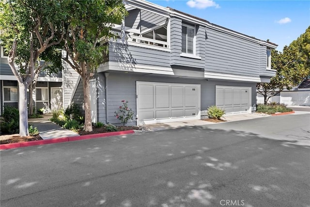 townhome / multi-family property featuring an attached garage