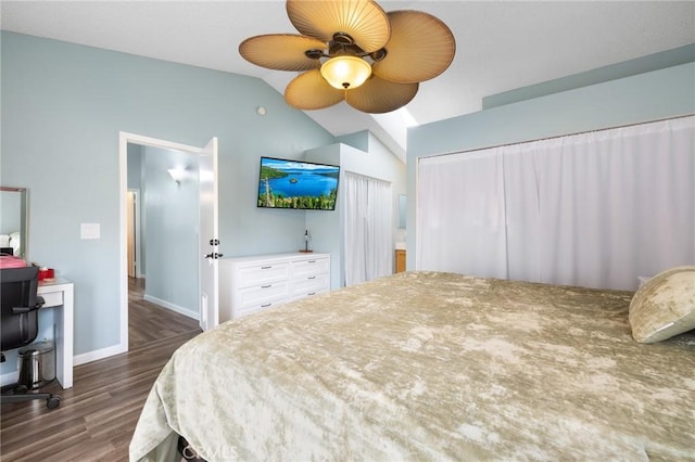 bedroom with wood finished floors, a ceiling fan, baseboards, and vaulted ceiling