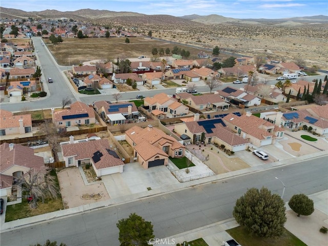 drone / aerial view featuring a residential view and a mountain view