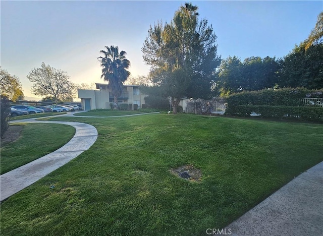 view of yard at dusk