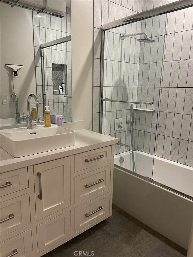 full bathroom with vanity and shower / bath combination with glass door