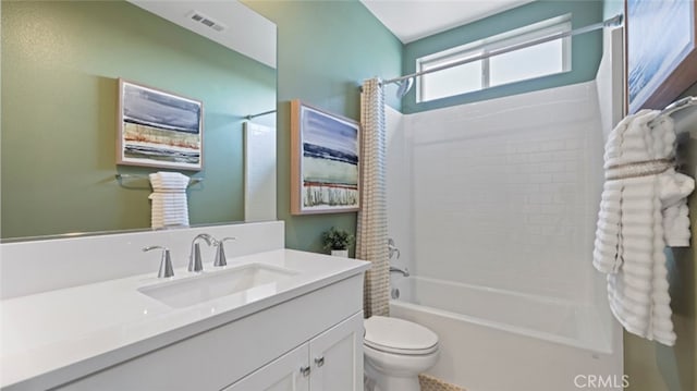 full bath with vanity, toilet, visible vents, and shower / bathtub combination