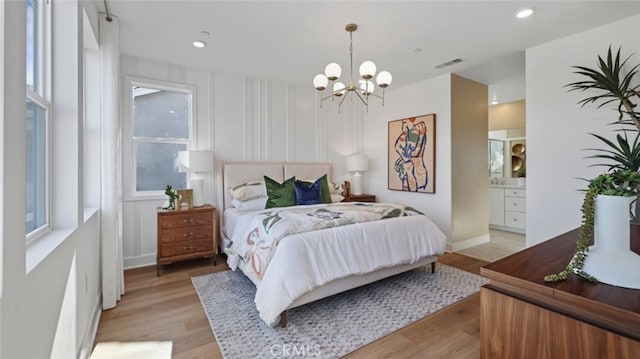 bedroom with a notable chandelier, recessed lighting, visible vents, and light wood-type flooring