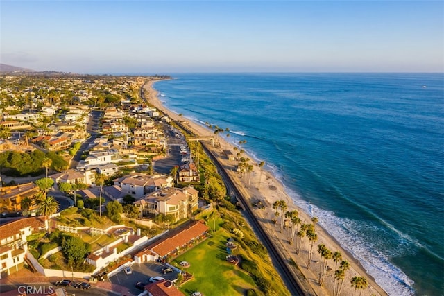 bird's eye view with a view of the beach and a water view