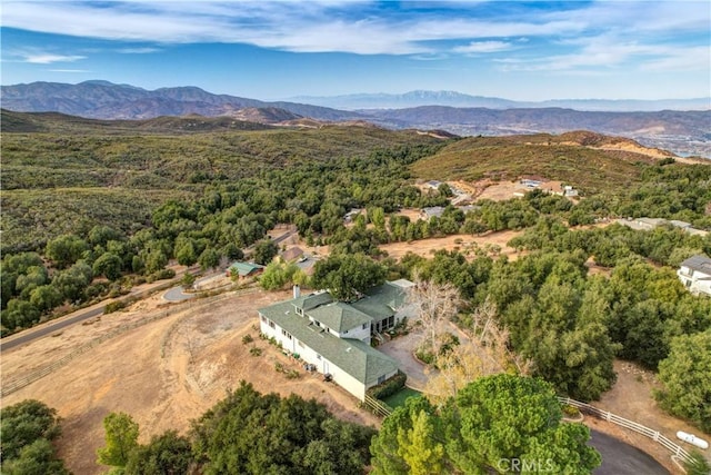 drone / aerial view with a view of trees and a mountain view