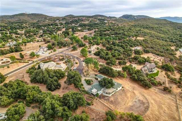 birds eye view of property featuring a mountain view