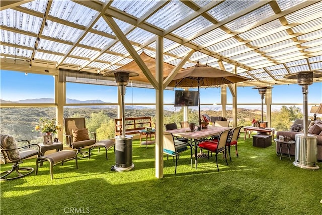 view of patio / terrace with a mountain view and a pergola