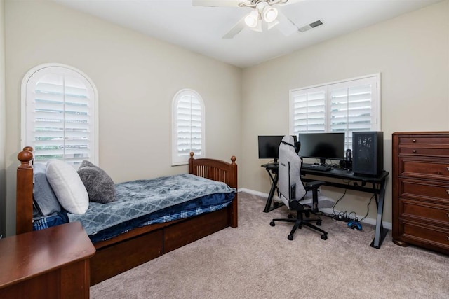 bedroom with visible vents, multiple windows, and carpet