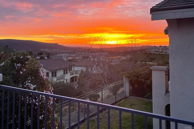 balcony at dusk with a mountain view