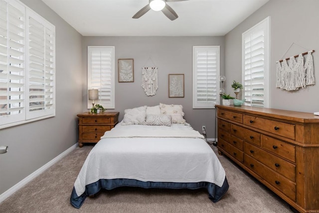 bedroom featuring carpet flooring, baseboards, and ceiling fan