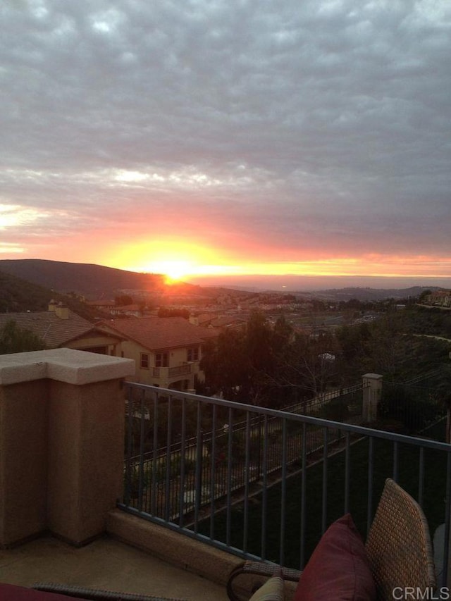 view of balcony at dusk